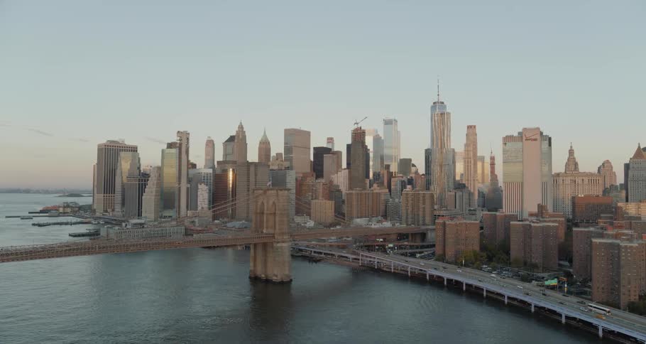 A bridge with buildings and skyscrapers in the background