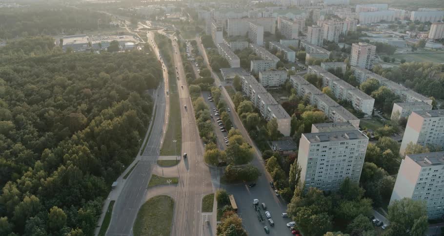 Apartment blocks spread across a neighborhood near a highway