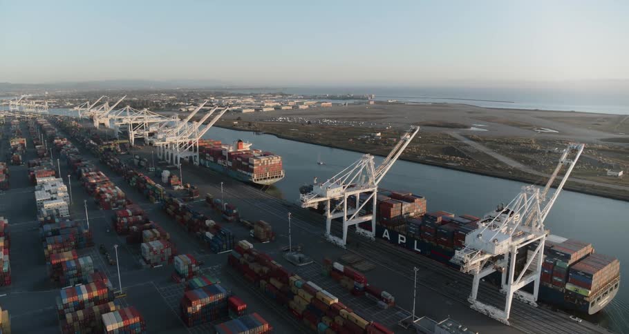 A shipping port full of shipping containers and cranes