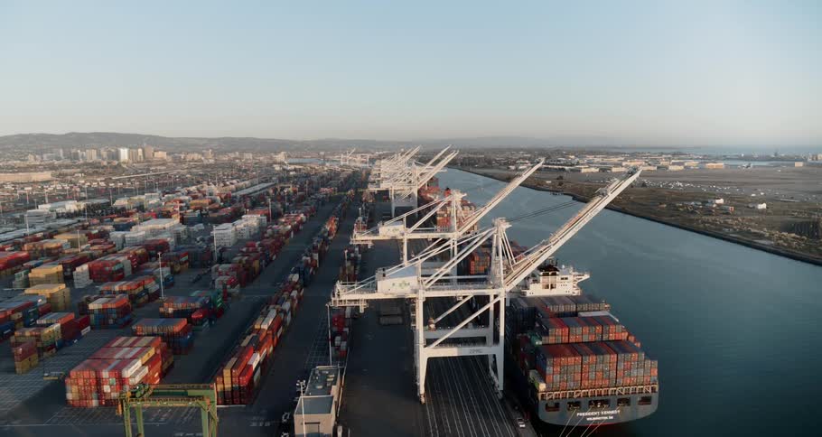 A shipping dock with shipping containers and shipping tankers