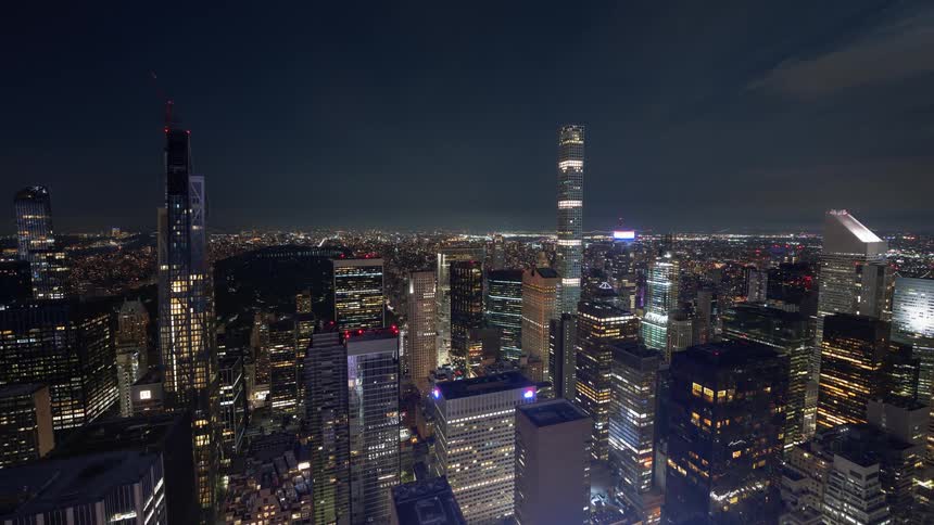 The skyscrapers and rooftops of new york city at night