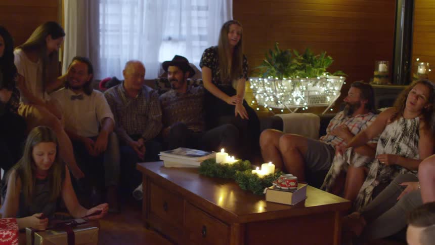 A family in their living room at christmas