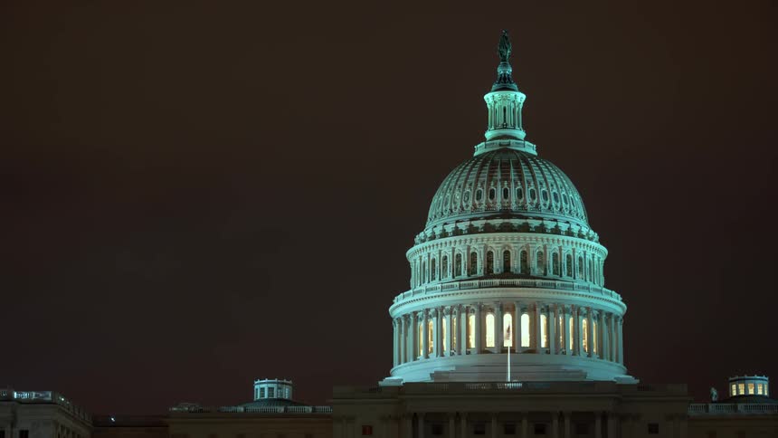 The united states capitol building at night