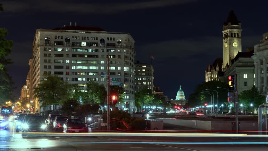Traffic moves through a busy intersection in washington dc