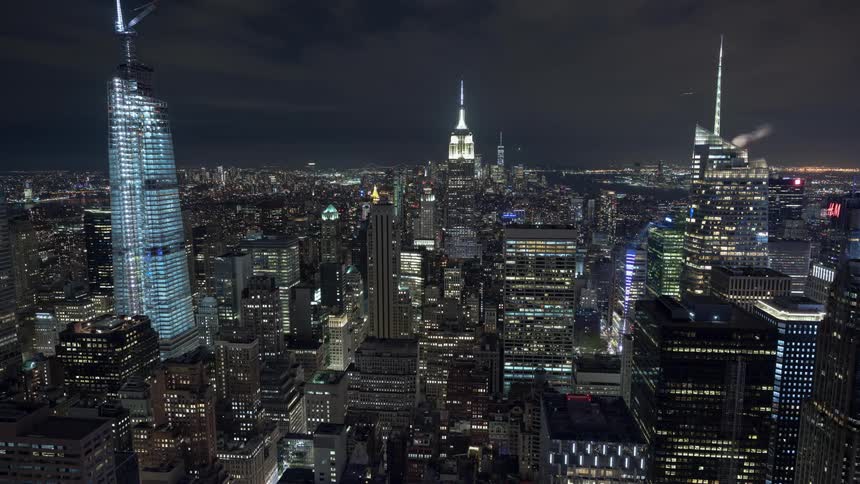 The flashing and glowing spires on skyscrapers in new york city at night