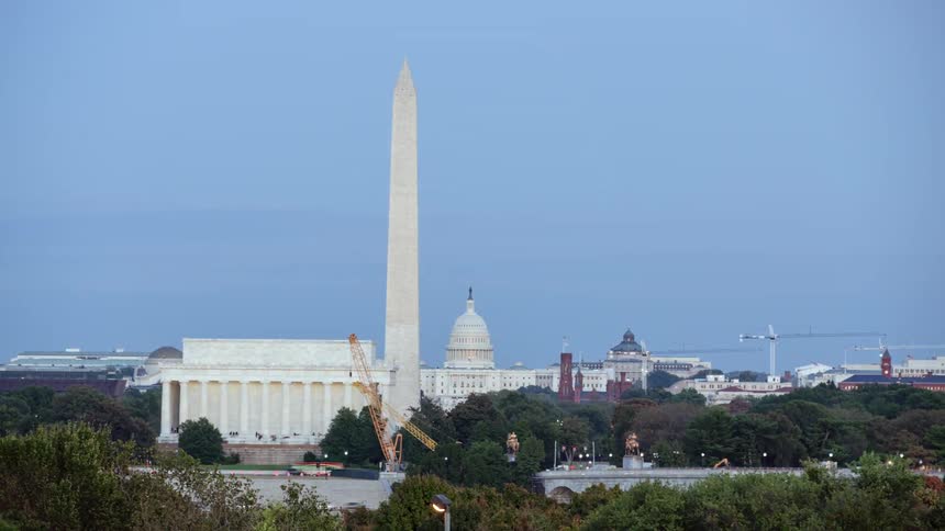 Time lapse view of cars driving past a monument
