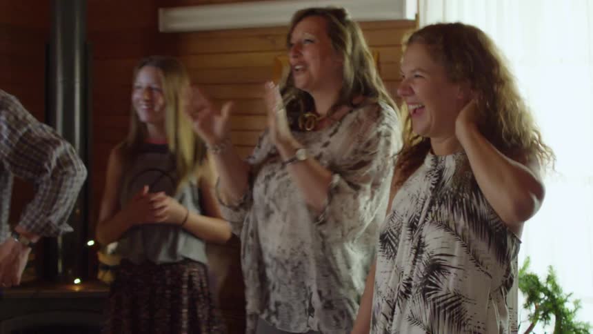 A group of people laughing and talking