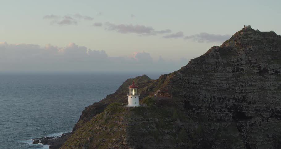 A lighthouse on a promontory overlooking the ocean