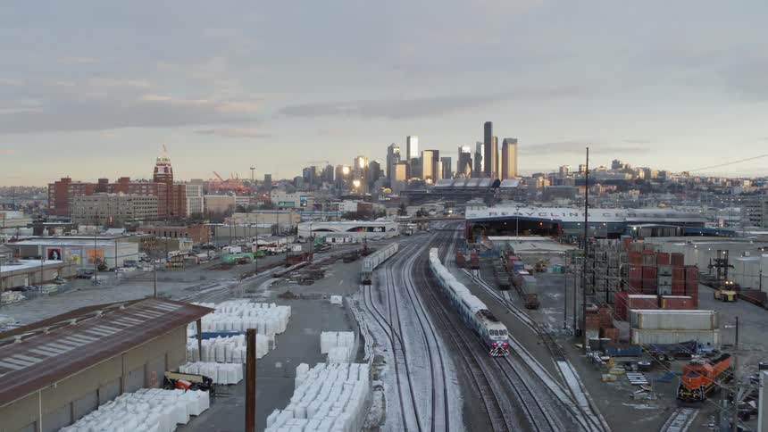 Following a morning commuter train as it heads toward downtown thru the SoDo industrial area