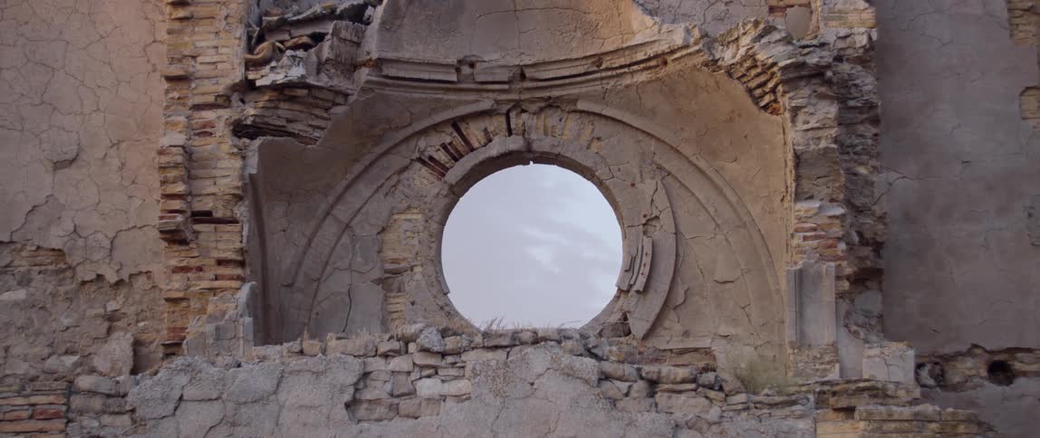 Bricks and debris fall from ancient ruins