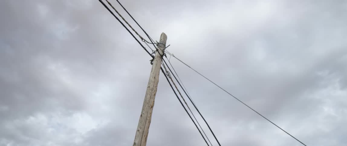 Multiple power lines are connected to a utility pole