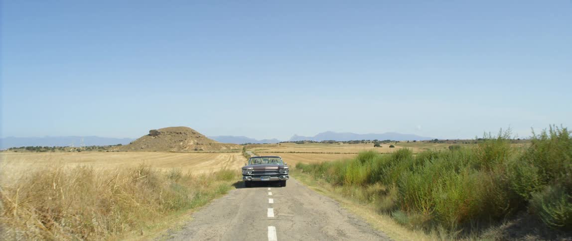 A car driving down a country road