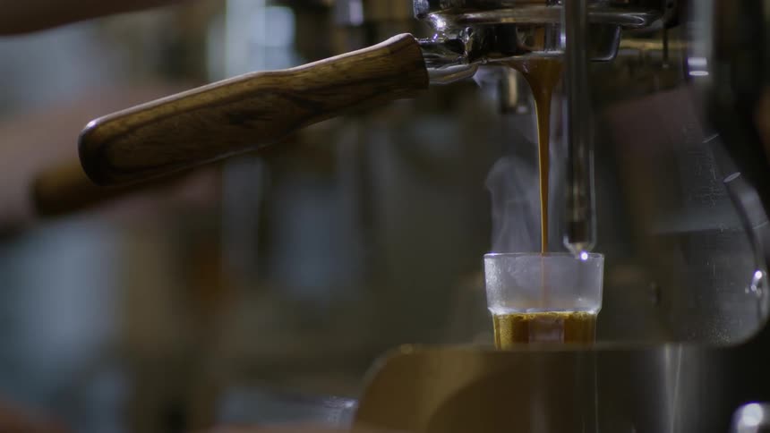 A shot of espresso is poured