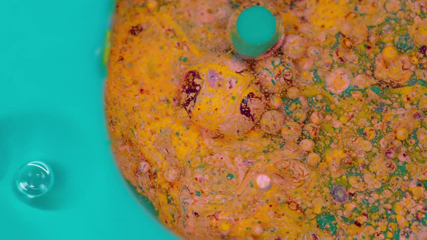 Paint is being mixed in a bowl