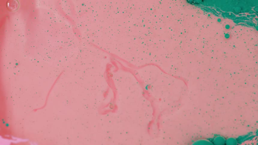 Globs of oil move in a liquid