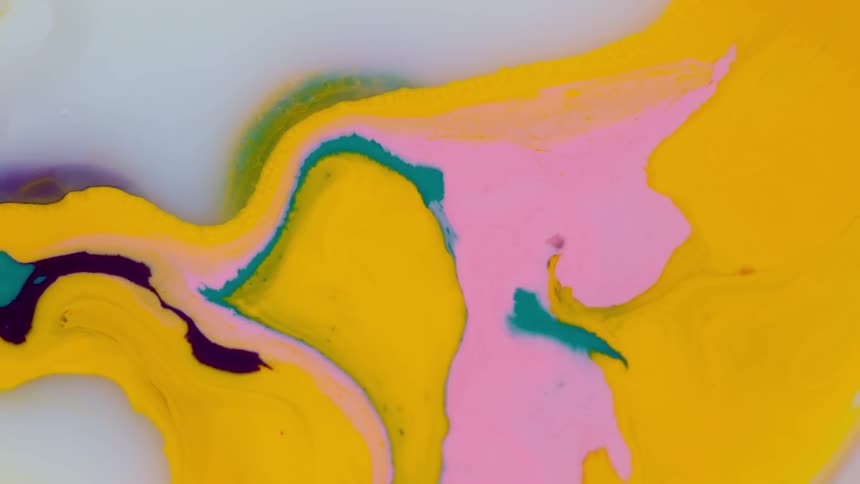 Bright colors of paint make an abstract painting