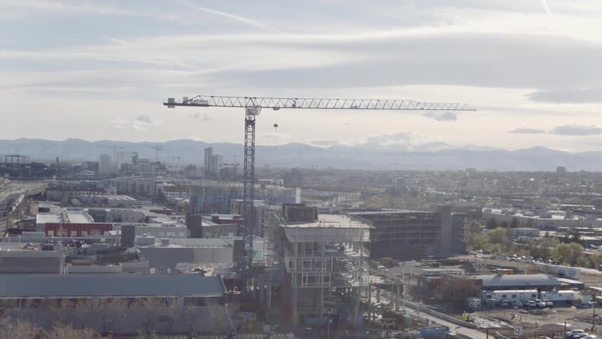 A crane stands over a construction site