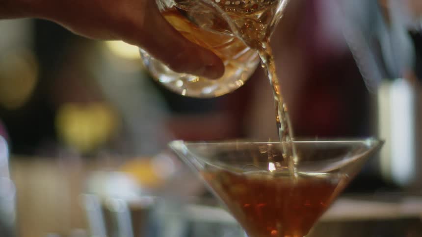 A liquid being poured into a glass