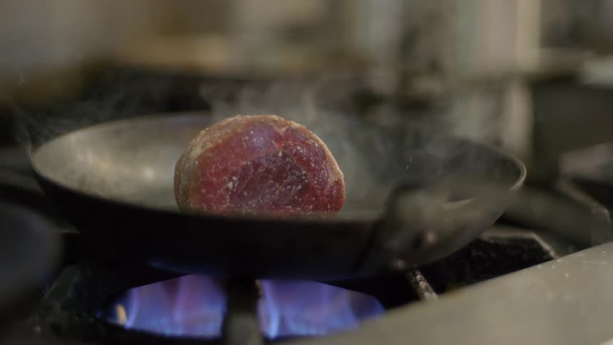A piece of meat being cooked