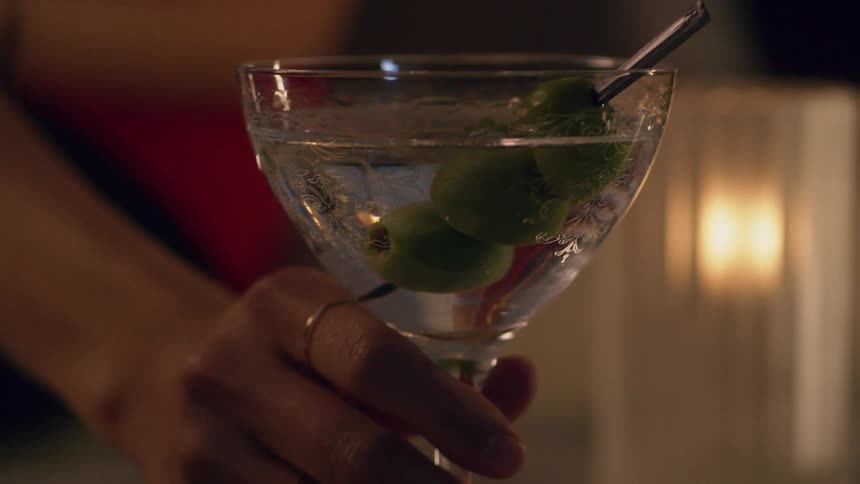 A person is grabbing an alcoholic beverage