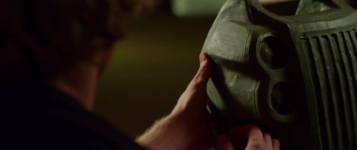 A man is feeling an object with his hand