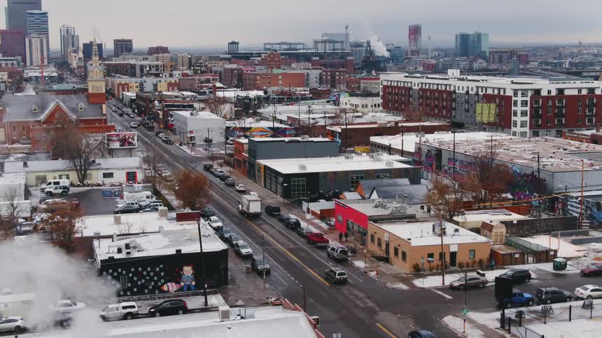 Aerial view of cars driving down a city street