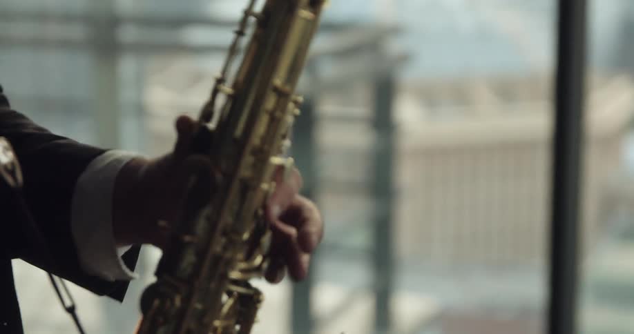 A man plays the saxophone
