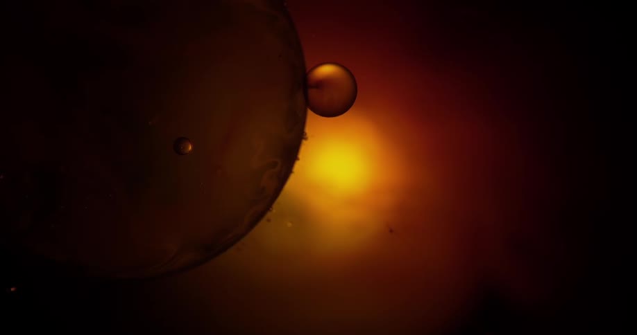 Smaller orbs attached to a large sphere in a golden light