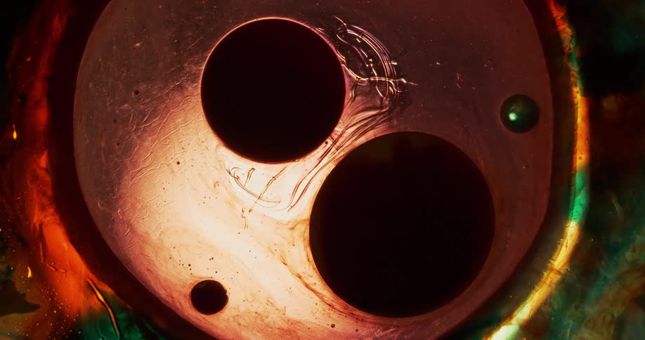 Bubbles enclosed in a larger bubble in multicolor fluid
