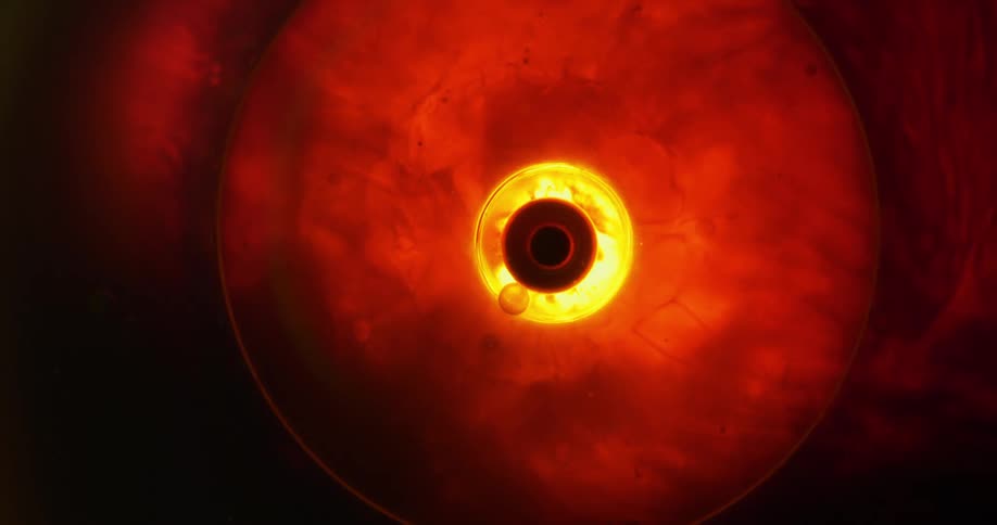 Close up of an eye through a lens