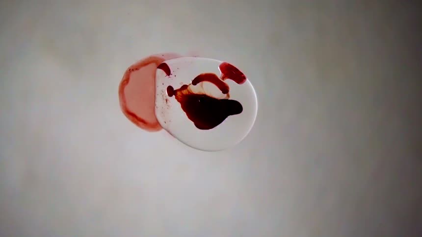 Birds eye view of liquids spreading out