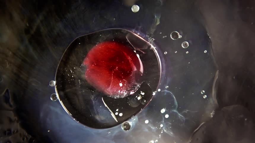 Liquids are being poured into a bowl