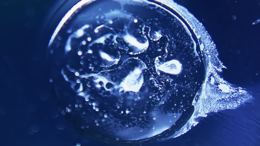The water moves around the sphere