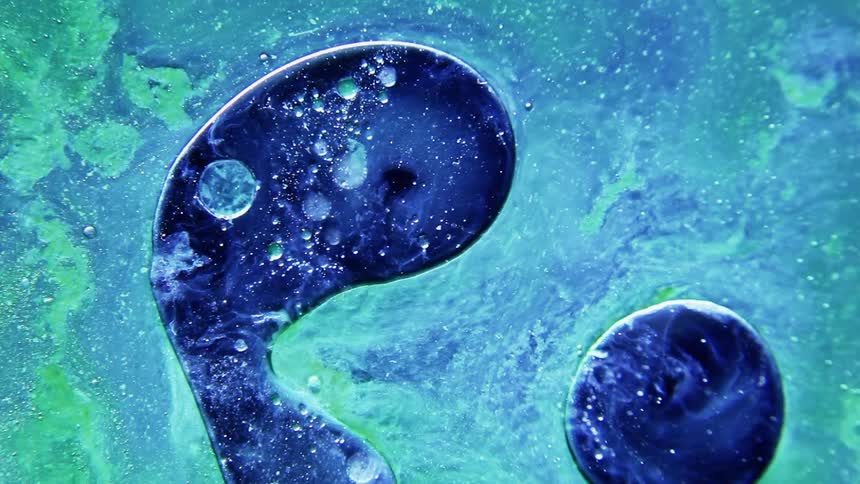 Dark blue liquid moves in a lighter blue liquid