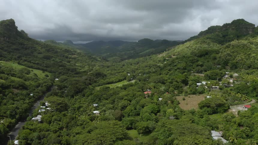 The hillside under the clouds