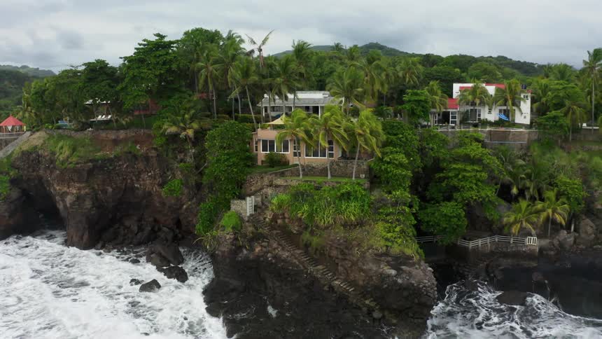 The houses are built on the shore cliff of the island