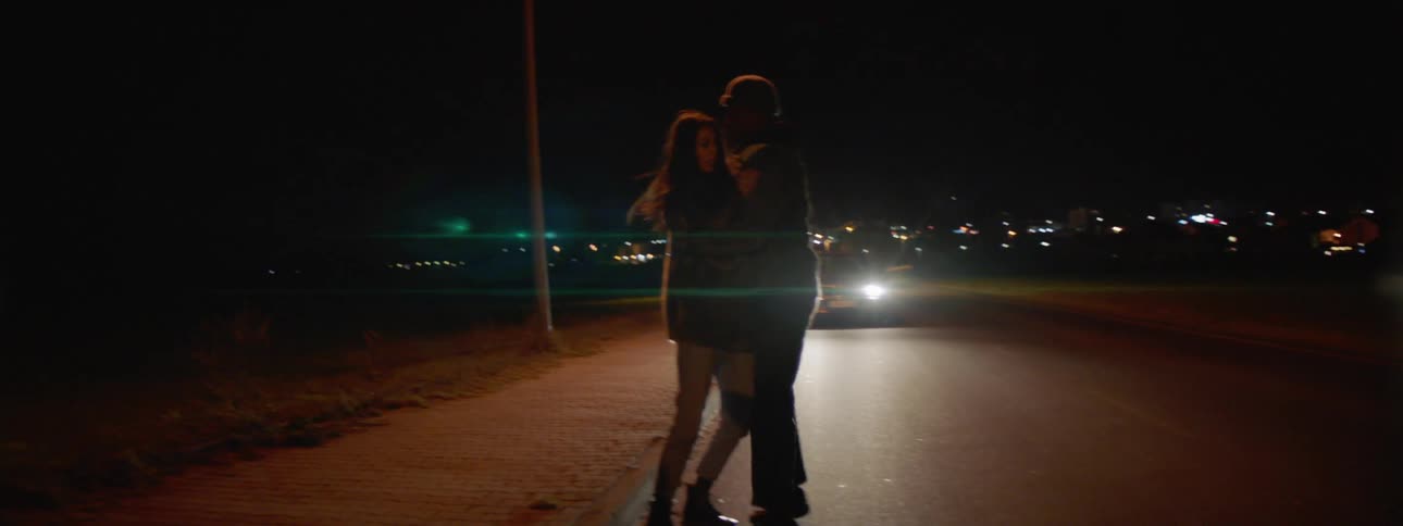 Two people fight on the street