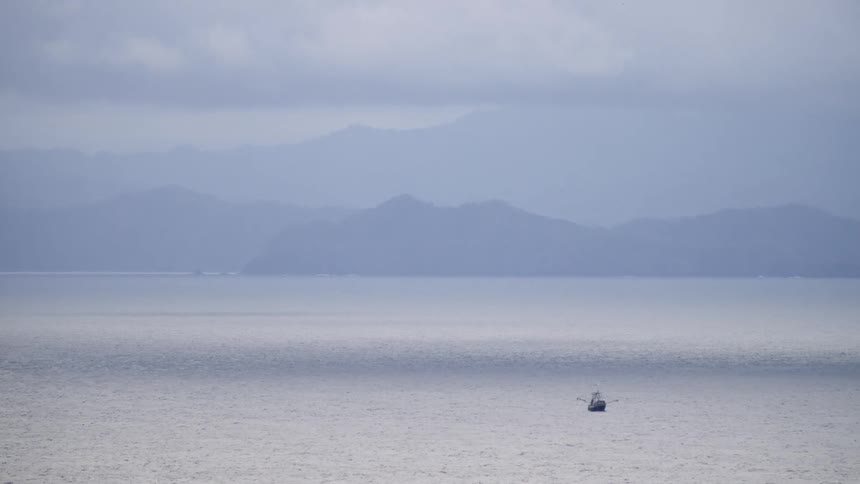 Landscape view of a lake with a boat on it