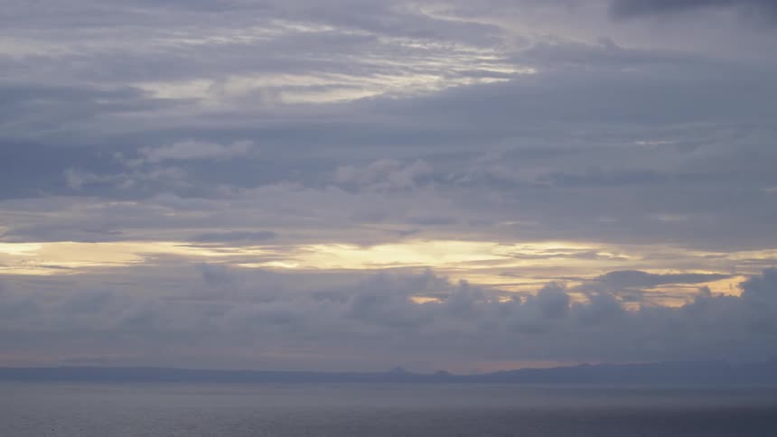 The coast with clouds and the sky in the background