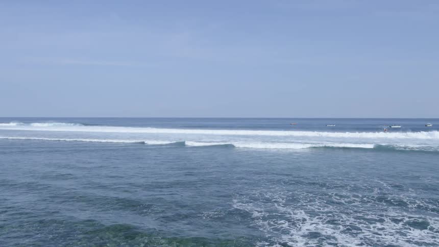 Ocean waves crash as they move into shallow water