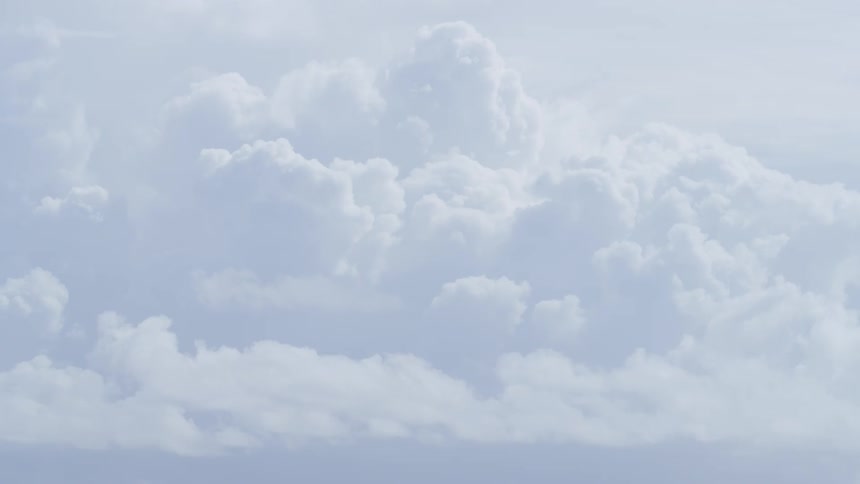 A large cloud formation sits idly in the sky as there is little wind