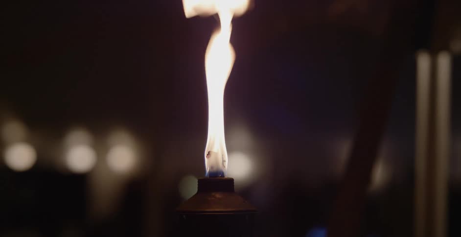 A flame burns in a torch