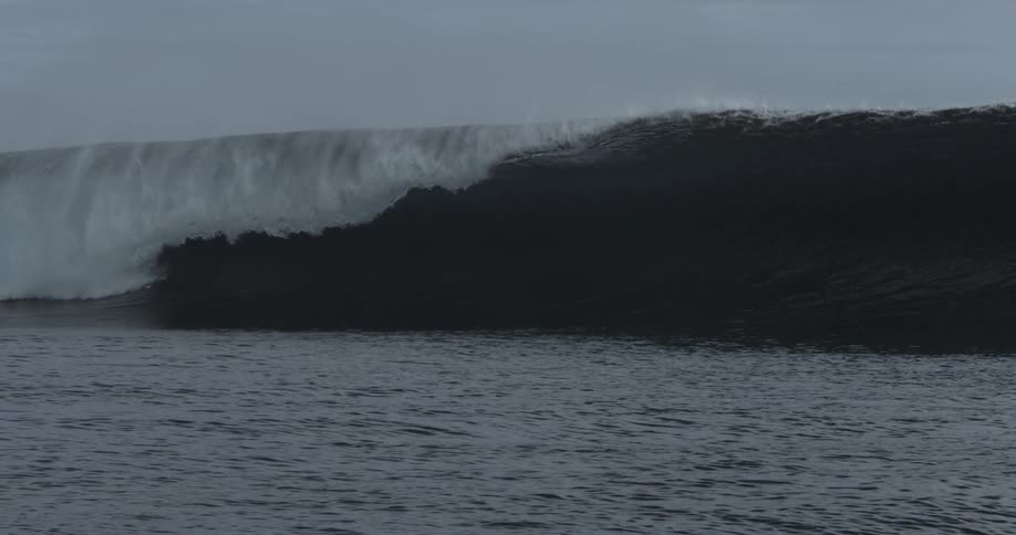 Large wave crashing against the beach