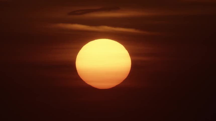 The sun is setting turning the sky red