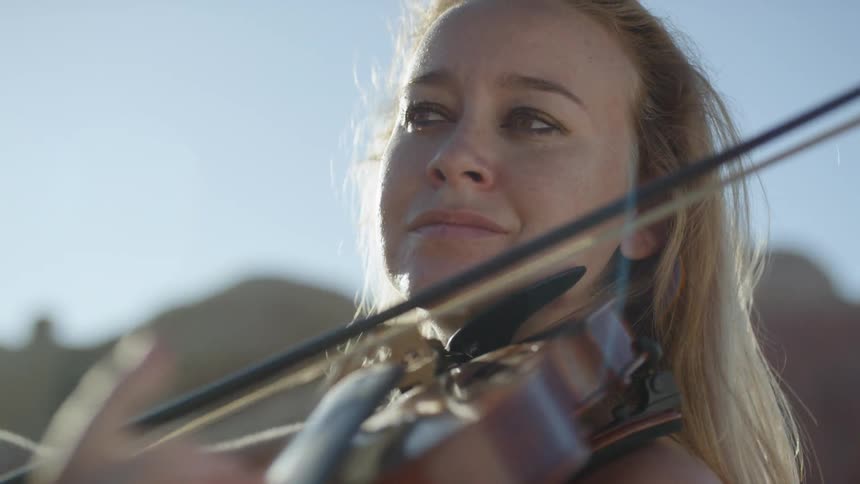 A woman plays the violin