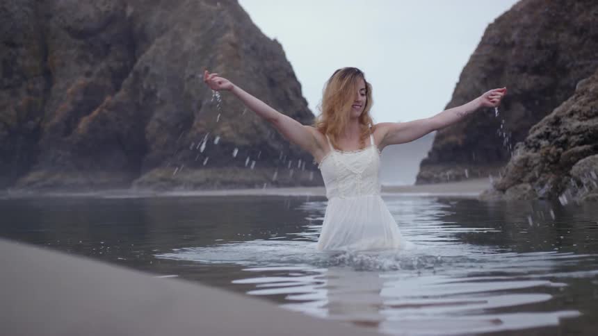 A woman plays in the water