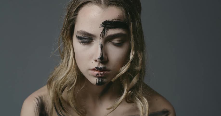 A woman with paint on her