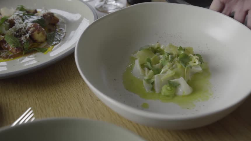Two plates with beautifully displayed food