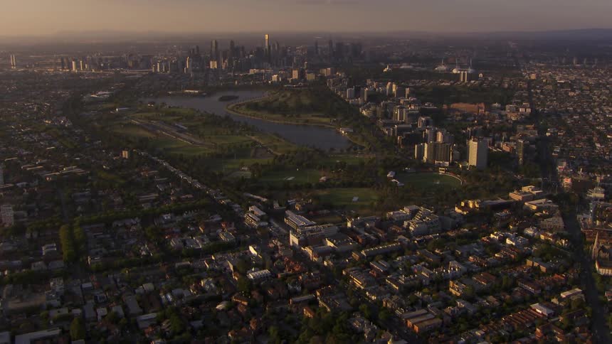 Aerial view of large city with a body of water in the middle