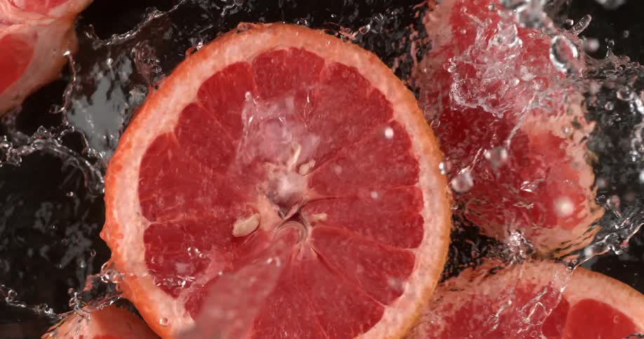 Grapefruit being splashed with water